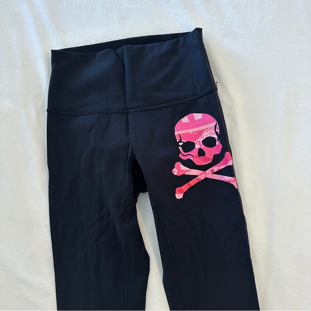 Lululemon black leggings with pink SoulCycle logo